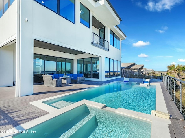 view of pool featuring an outdoor hangout area and a wooden deck