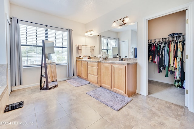 bathroom with vanity and tile patterned floors