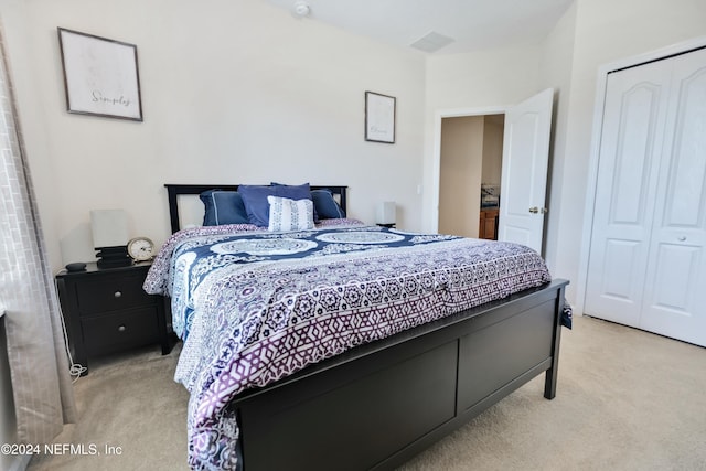 carpeted bedroom featuring a closet