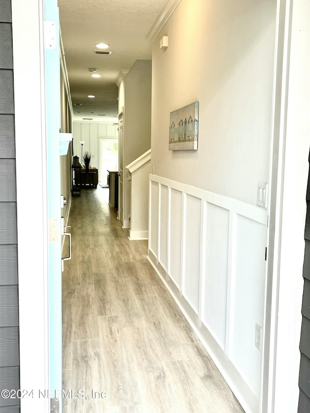 corridor with light wood-type flooring