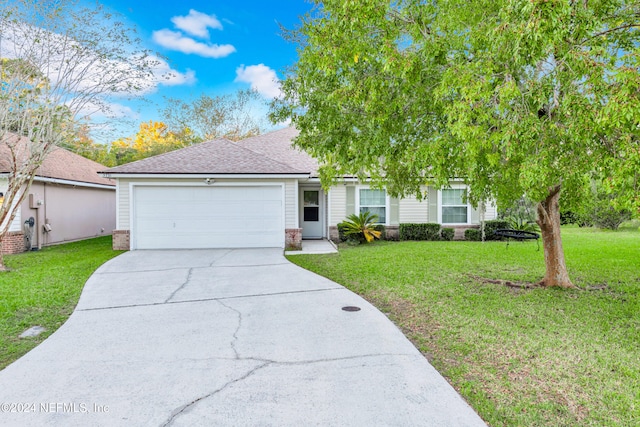 view of front facade featuring a front lawn and a garage