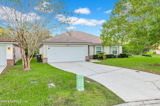 ranch-style home with a garage and a front lawn