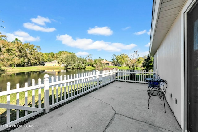 view of patio / terrace with a water view