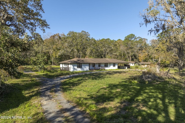 ranch-style home with a front yard