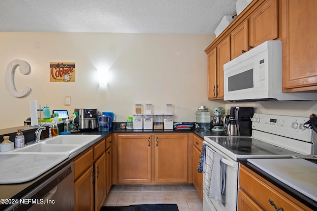 2975 SW Sunset Trace Cir Unit 2975, Palm City, FL 34990 - kitchen with light tile patterned flooring, a textured ceiling, white appliances, and sink