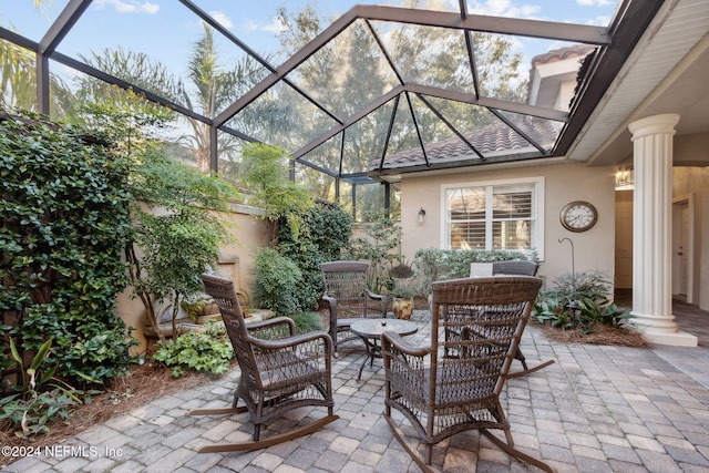 view of patio / terrace with glass enclosure