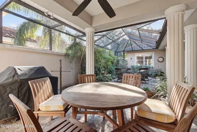 sunroom with vaulted ceiling and ceiling fan