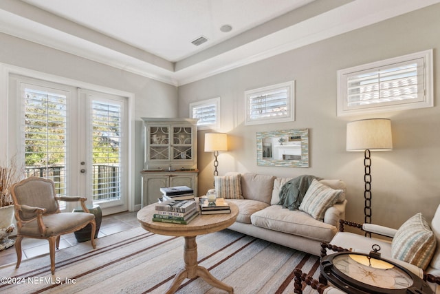 tiled living room featuring french doors