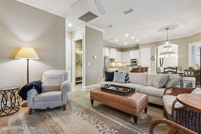 living room with ceiling fan, light tile patterned floors, and ornamental molding