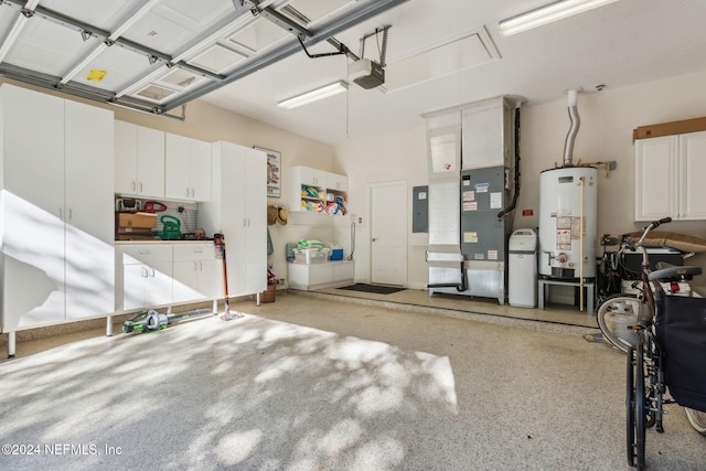 garage with electric panel, a garage door opener, and water heater