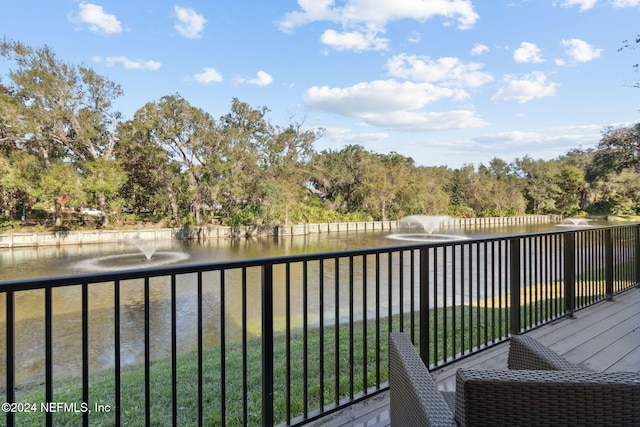 balcony featuring a water view