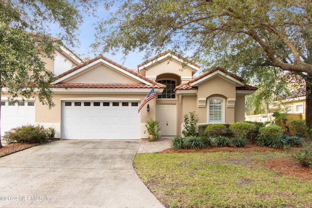 view of front of home with a garage