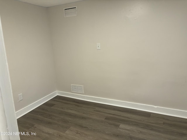 spare room featuring dark hardwood / wood-style floors