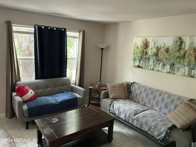 tiled living room with a textured ceiling