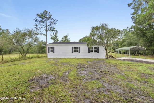 view of property exterior with a carport and a lawn