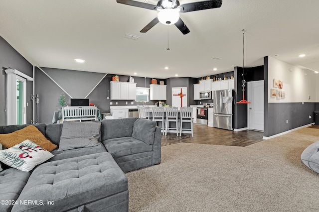 living room with ceiling fan and dark hardwood / wood-style floors