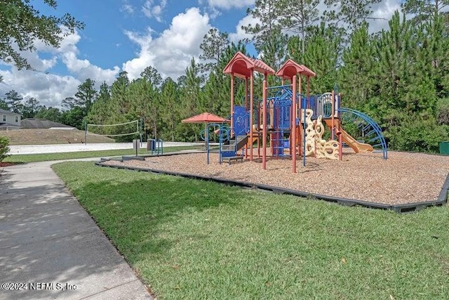 view of playground with a lawn