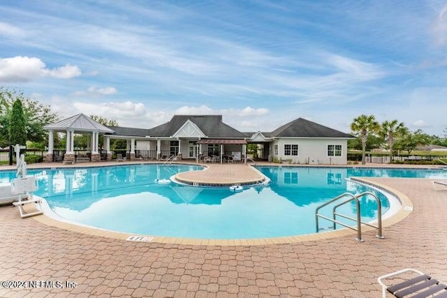 view of swimming pool featuring a patio area