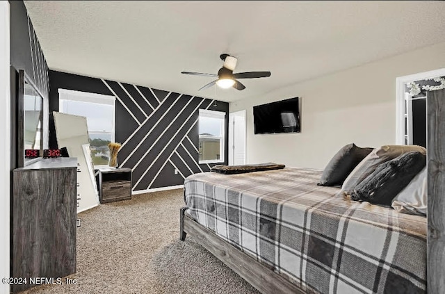 carpeted bedroom with multiple windows and ceiling fan