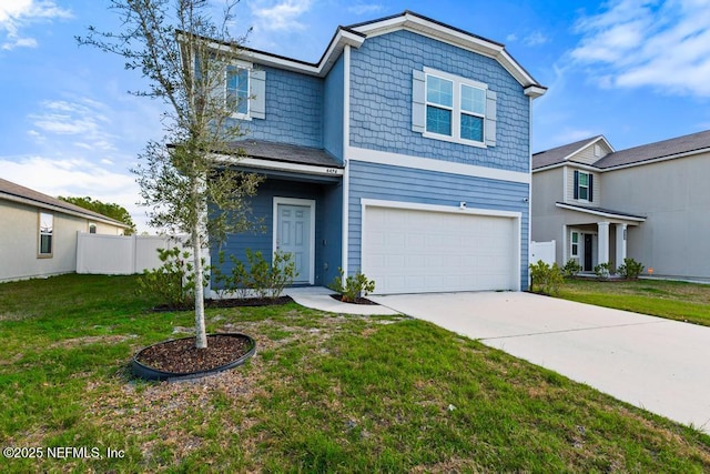 view of front of property with a garage and a front yard