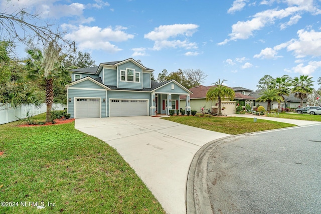 view of front facade with a front yard and a garage