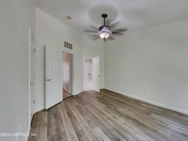 unfurnished bedroom with ceiling fan and light hardwood / wood-style floors