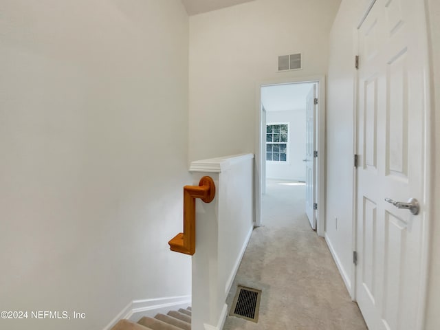 hallway with light carpet