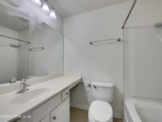 bathroom featuring tile patterned floors, vanity, and toilet