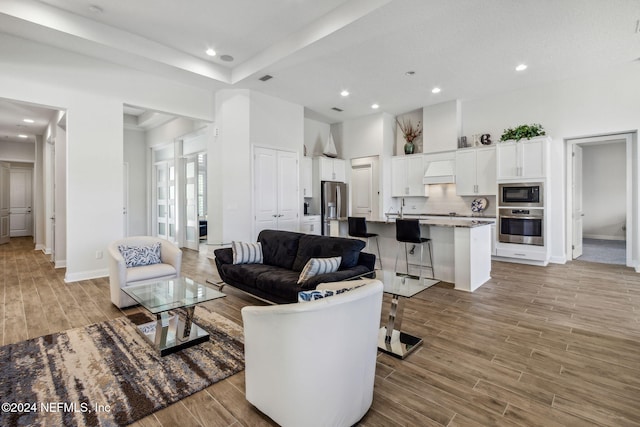 living room featuring a towering ceiling