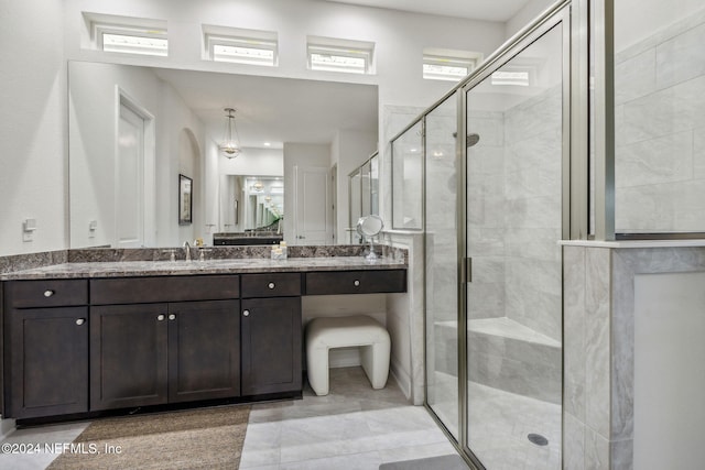 bathroom with vanity and an enclosed shower