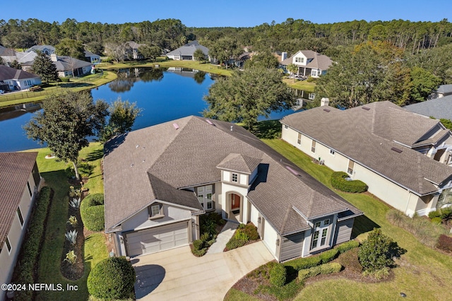 birds eye view of property featuring a water view