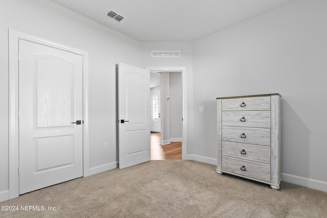 unfurnished bedroom with light carpet