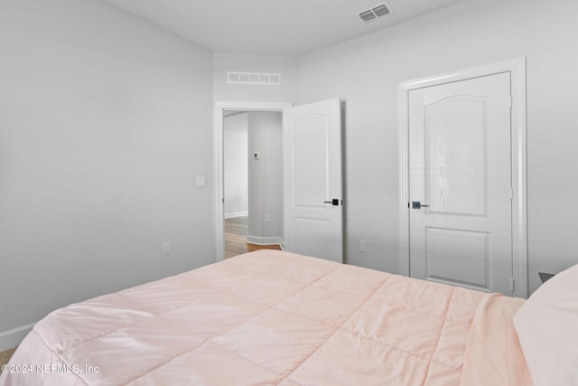 bedroom featuring hardwood / wood-style flooring