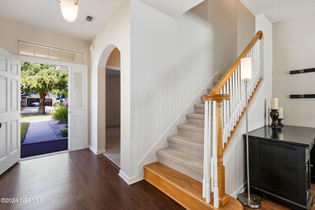 foyer with dark hardwood / wood-style flooring