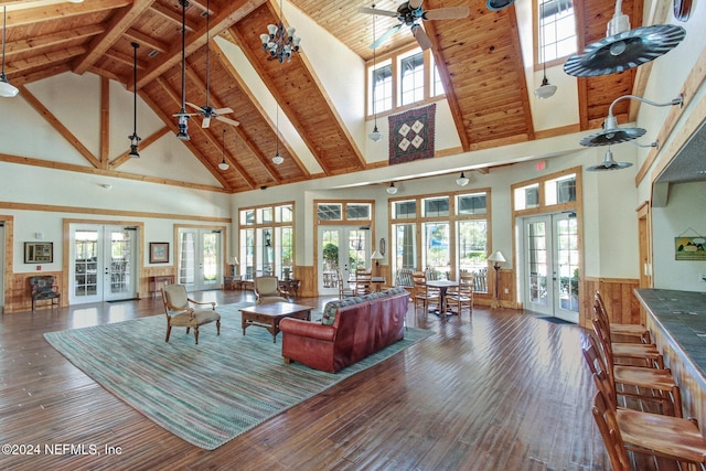 living room with french doors, high vaulted ceiling, and a healthy amount of sunlight