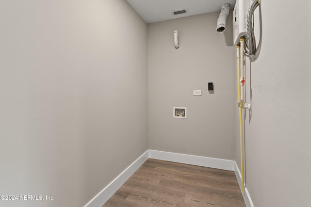 laundry area featuring hookup for a washing machine and wood-type flooring