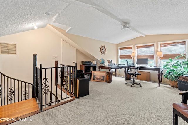 carpeted office space with lofted ceiling and a textured ceiling