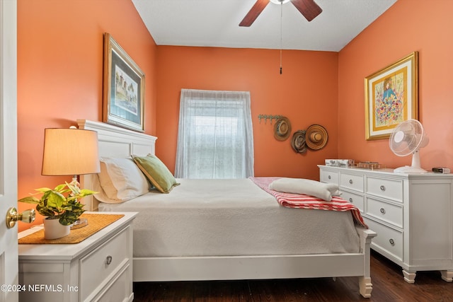 bedroom with dark wood-type flooring and ceiling fan