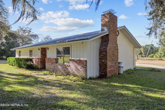 view of home's exterior featuring a yard