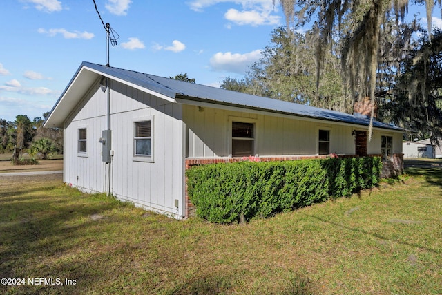 view of property exterior featuring a yard