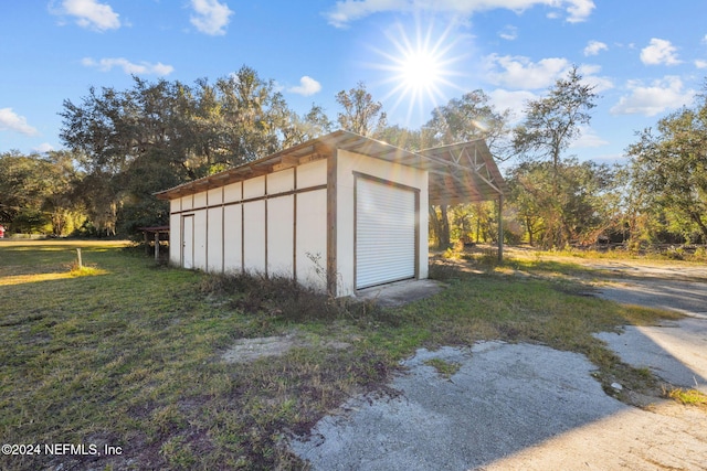 garage with a lawn