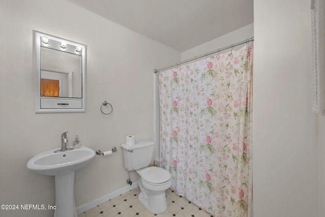 bathroom with toilet and walk in shower