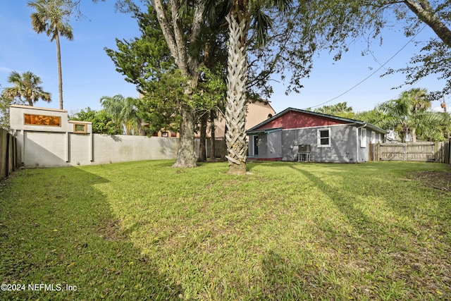 view of yard featuring central air condition unit