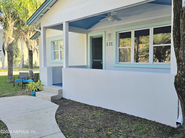 doorway to property featuring ceiling fan