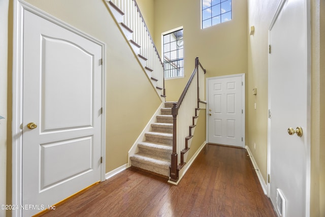 532 Dry Branch Way, Saint Johns, FL 32259 - foyer with wood finished floors, a towering ceiling, and stairs