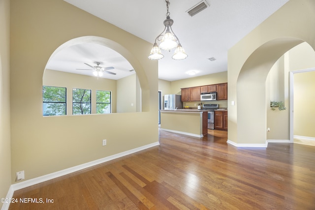 532 Dry Branch Way, Saint Johns, FL 32259 - kitchen with appliances with stainless steel finishes, open floor plan, ceiling fan, dark wood finished floors, and decorative light fixtures