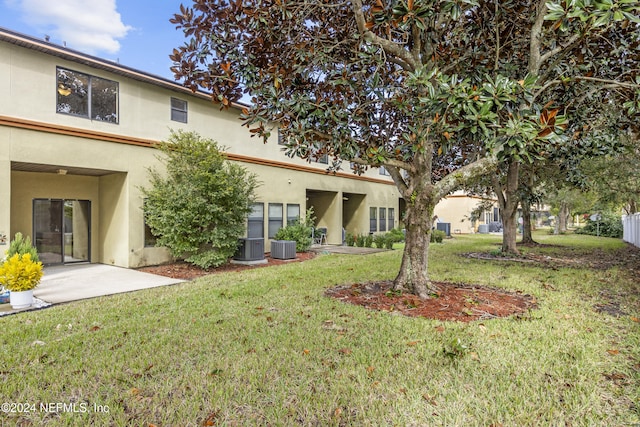 532 Dry Branch Way, Saint Johns, FL 32259 - back of house featuring stucco siding and a yard