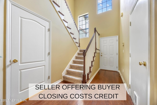 532 Dry Branch Way, Saint Johns, FL 32259 - foyer featuring healthy amount of natural light, wood finished floors, a towering ceiling, and stairs