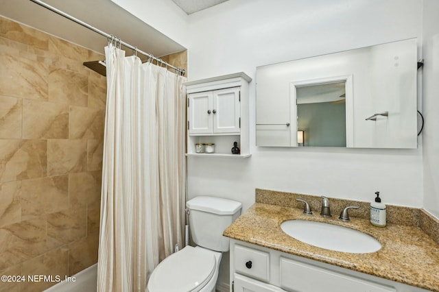 bathroom featuring a shower with shower curtain, vanity, and toilet