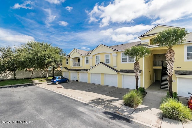 townhome / multi-family property with a garage